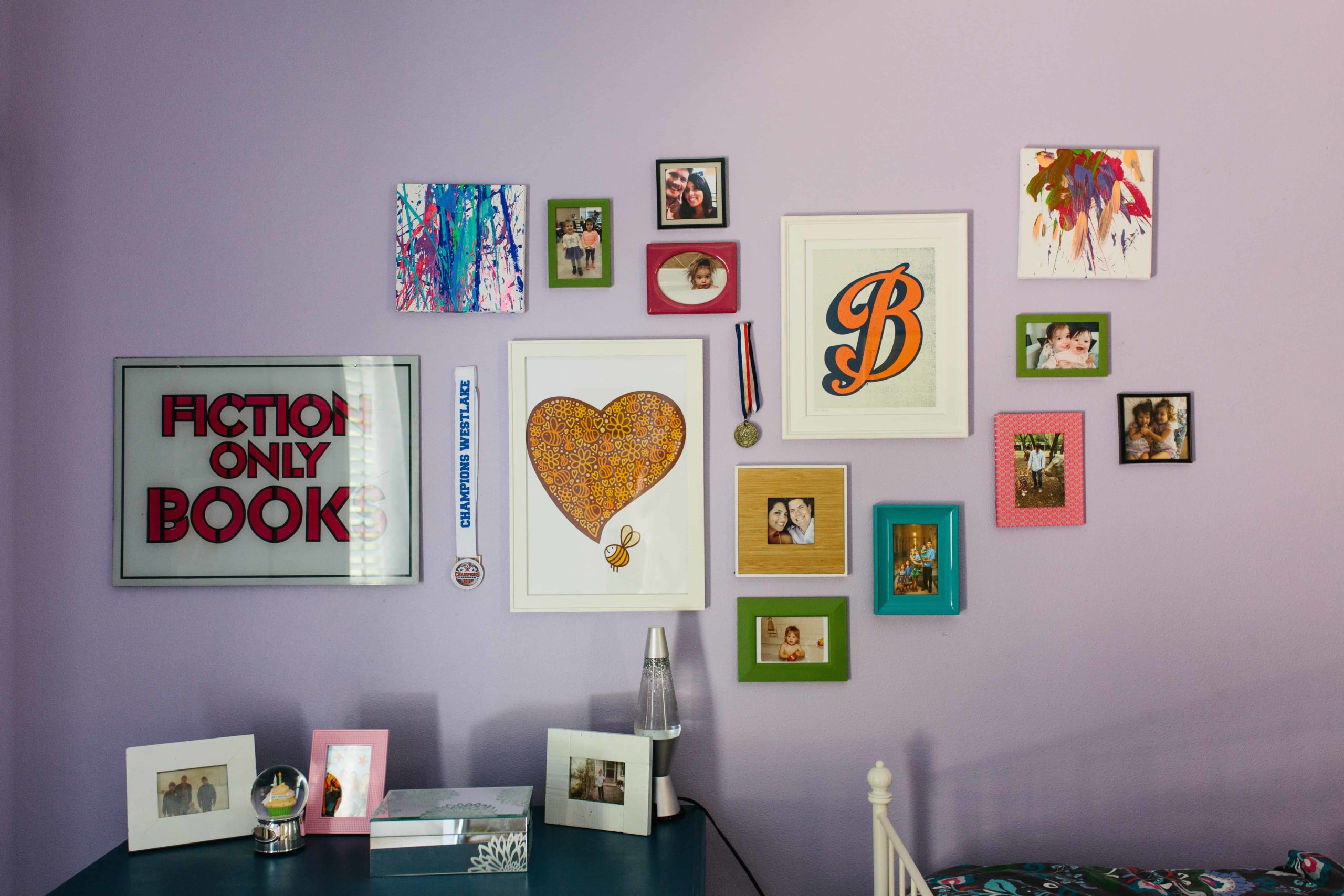 Kids room wall of frames in Austin, TX by BANDD DESIGN